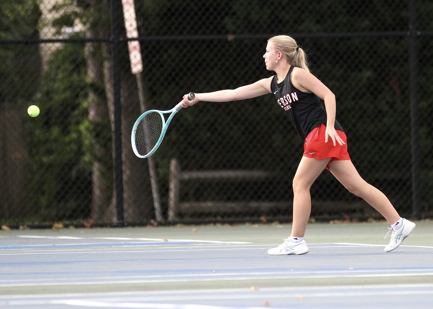 Senior Ally Cottrell reaches for a return. DESIRÉE KEEGAN
