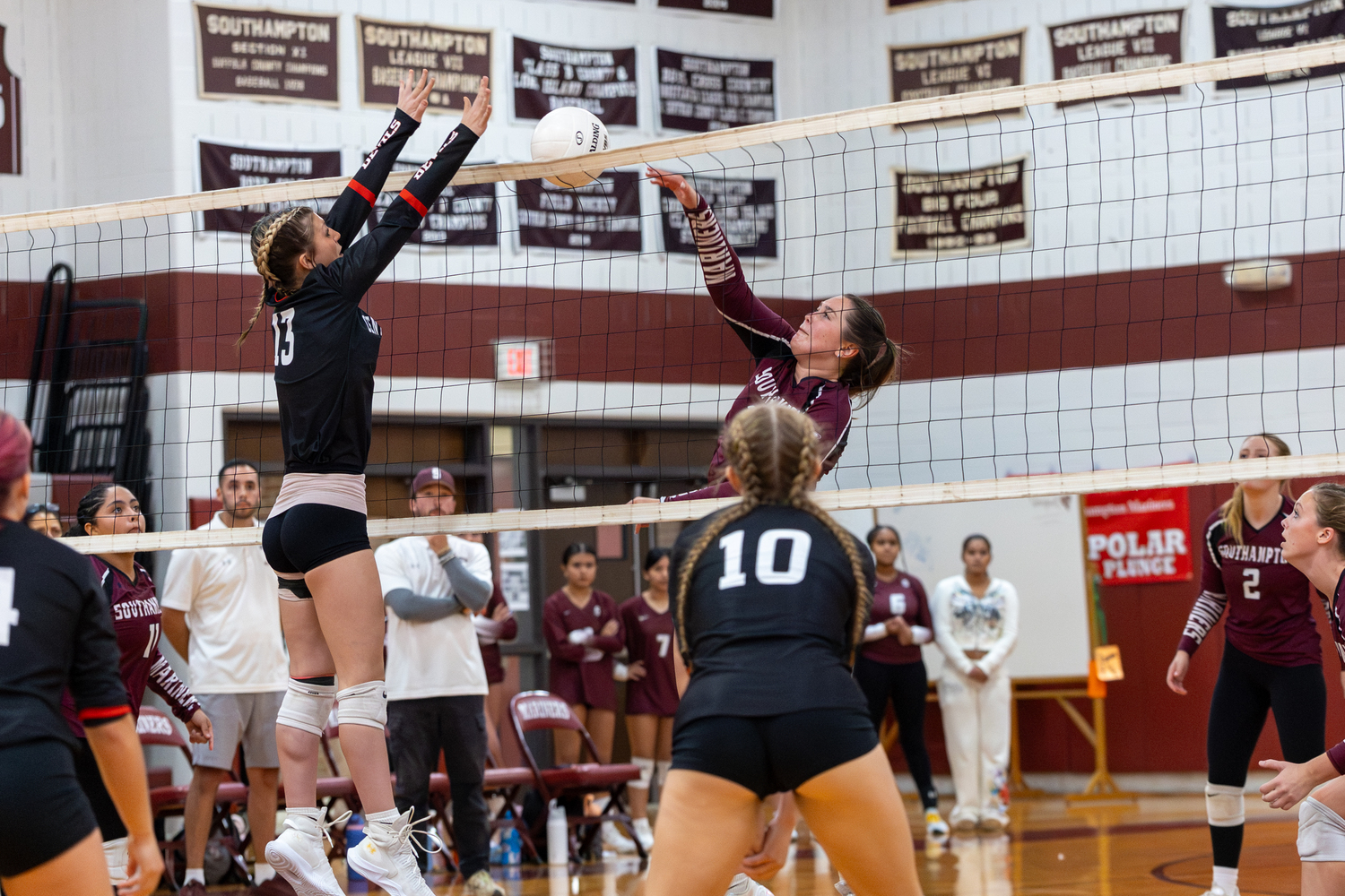 Avery Greene tries to get the ball up and over the net.  RON ESPOSITO