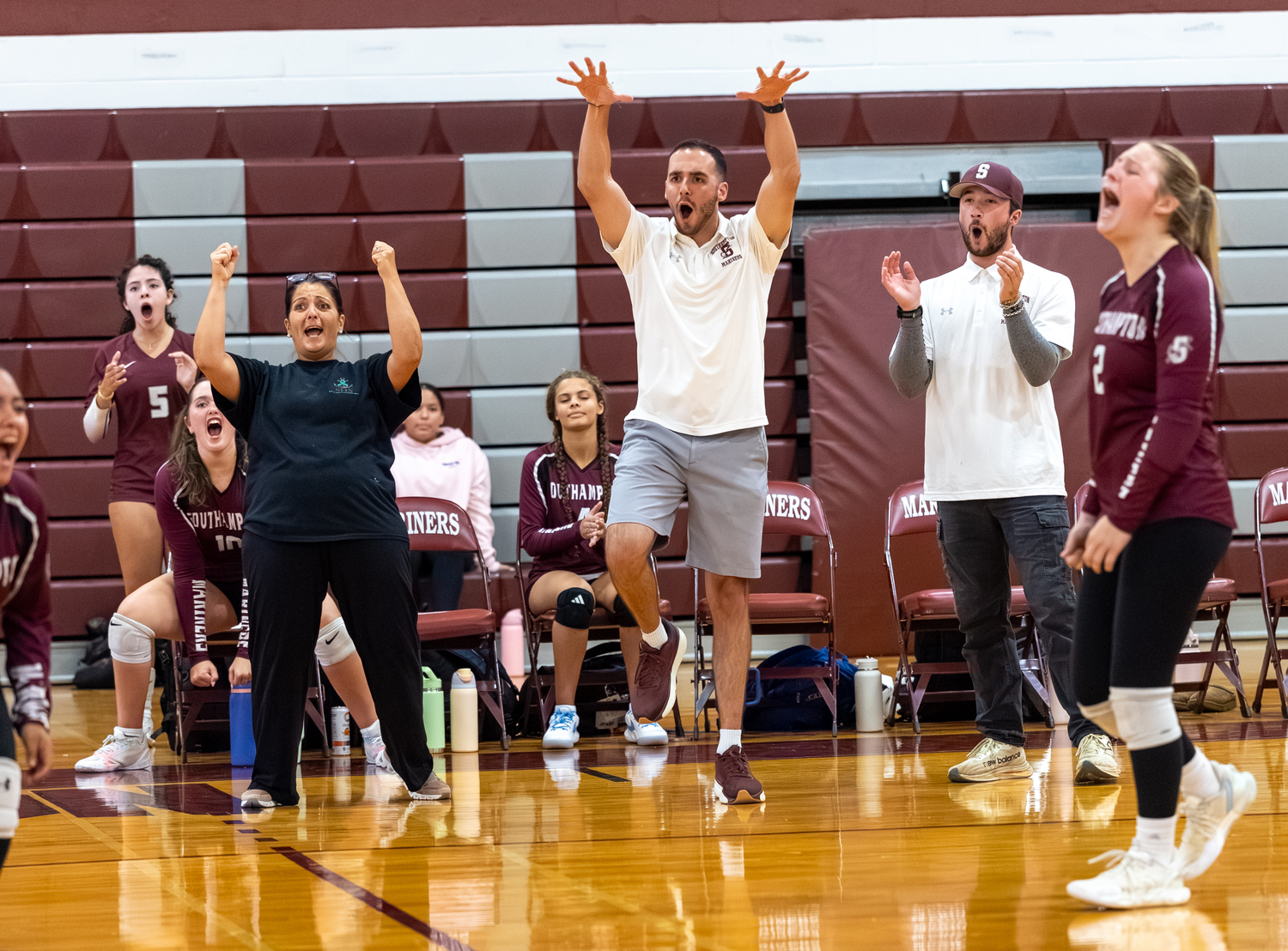 The Southampton coaching staff is pumped after a block.  RON ESPOSITO