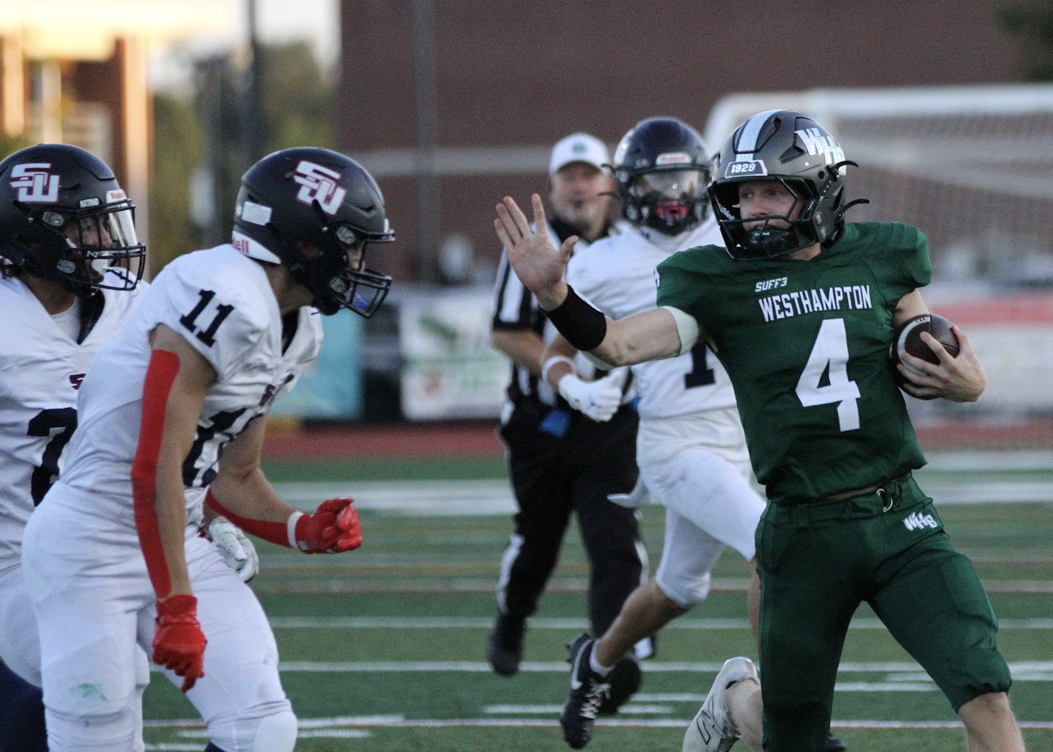 Junior quarterback Jake Calloway protects himself against a tackle. DESIRÉE KEEGAN