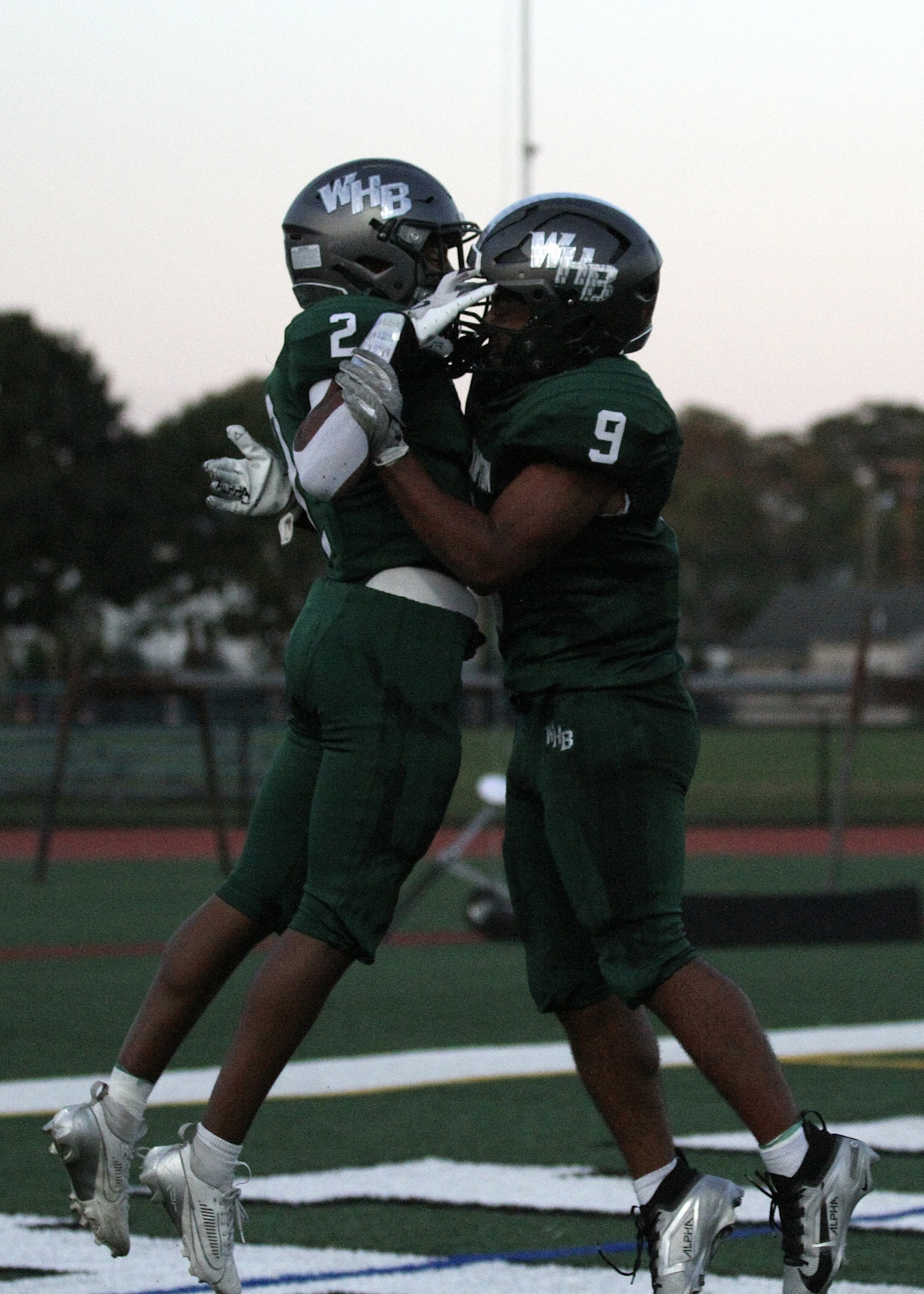Junior wide receiver Kyle Coffey and junior running back Nic Simone celebrate Coffey's touchdown. DESIRÉE KEEGAN