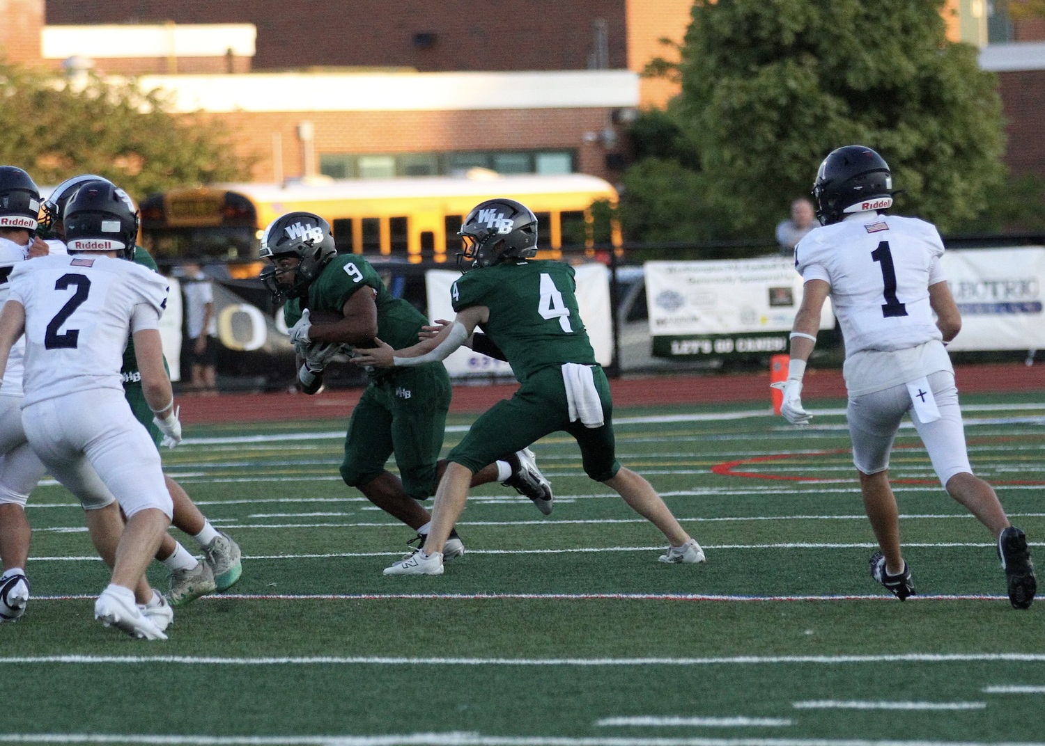 Junior running back Nic Simone takes the ball from junior quarterback Jake Calloway. DESIRÉE KEEGAN