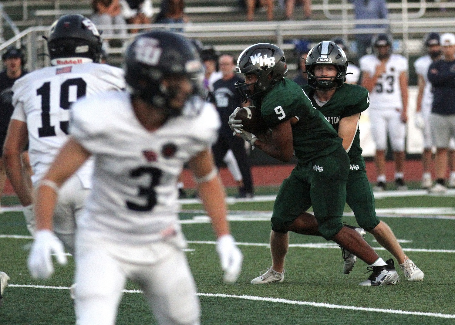 Junior running back Nic Simone takes a handoff from junior quarterback Jake Calloway. DESIRÉE KEEGAN
