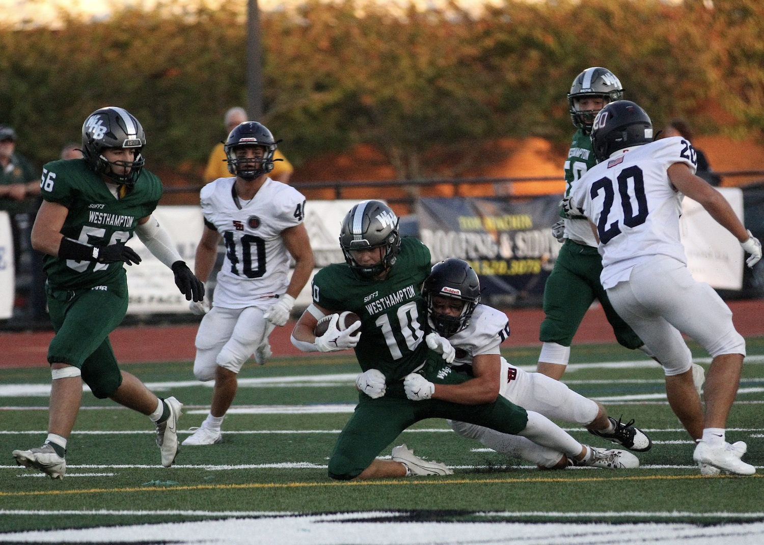 Senior wide receiver Pat Fay is taken down with the ball. DESIRÉE KEEGAN