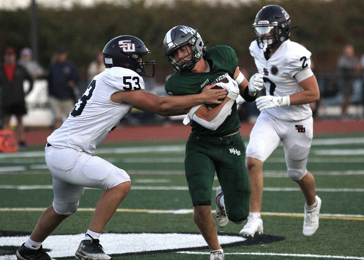 Senior wide receiver Pat Fay protects the ball as he moves up the field. DESIRÉE KEEGAN