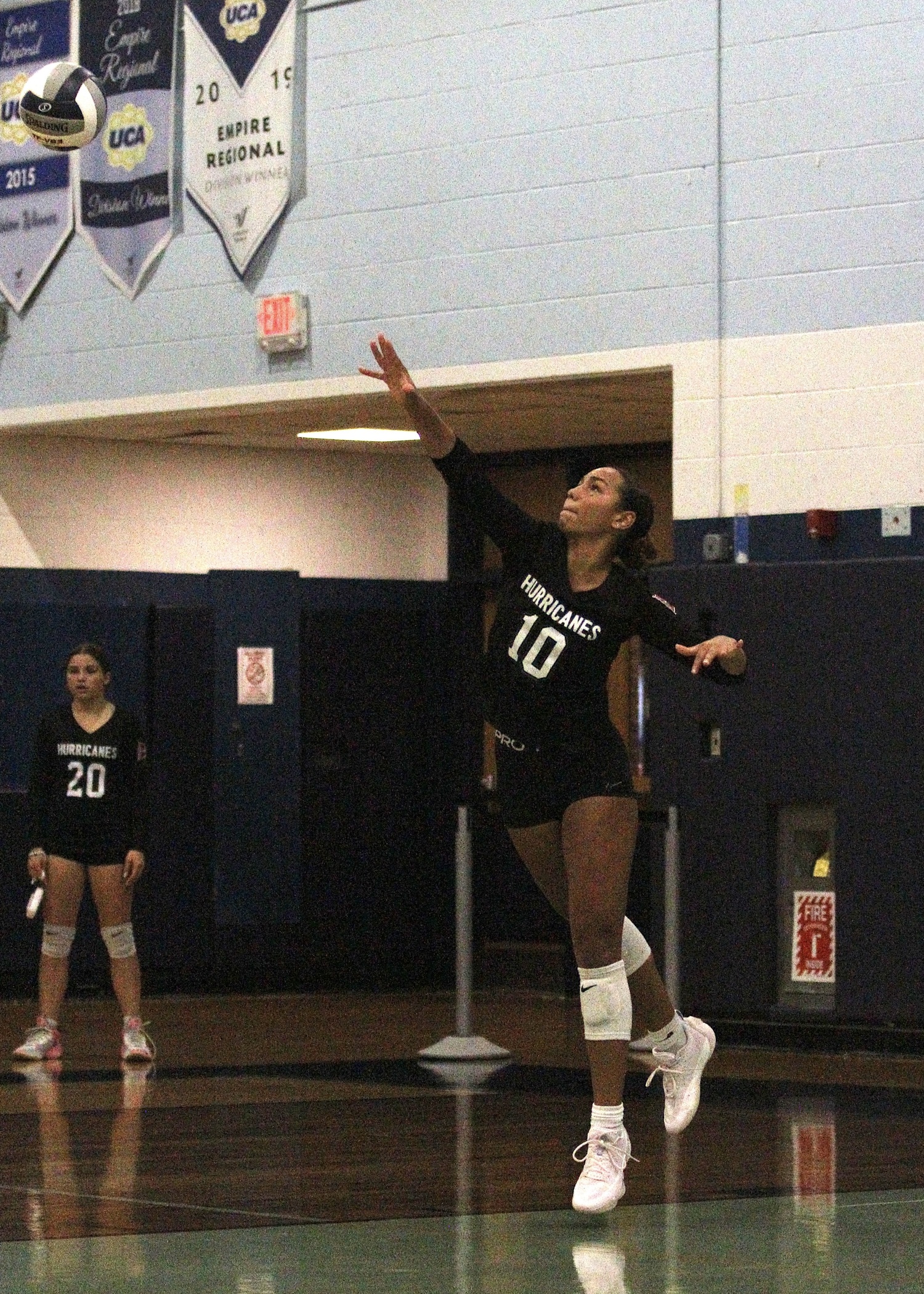 Senior middle blocker Jasmine Taylor serves. DESIRÉE KEEGAN