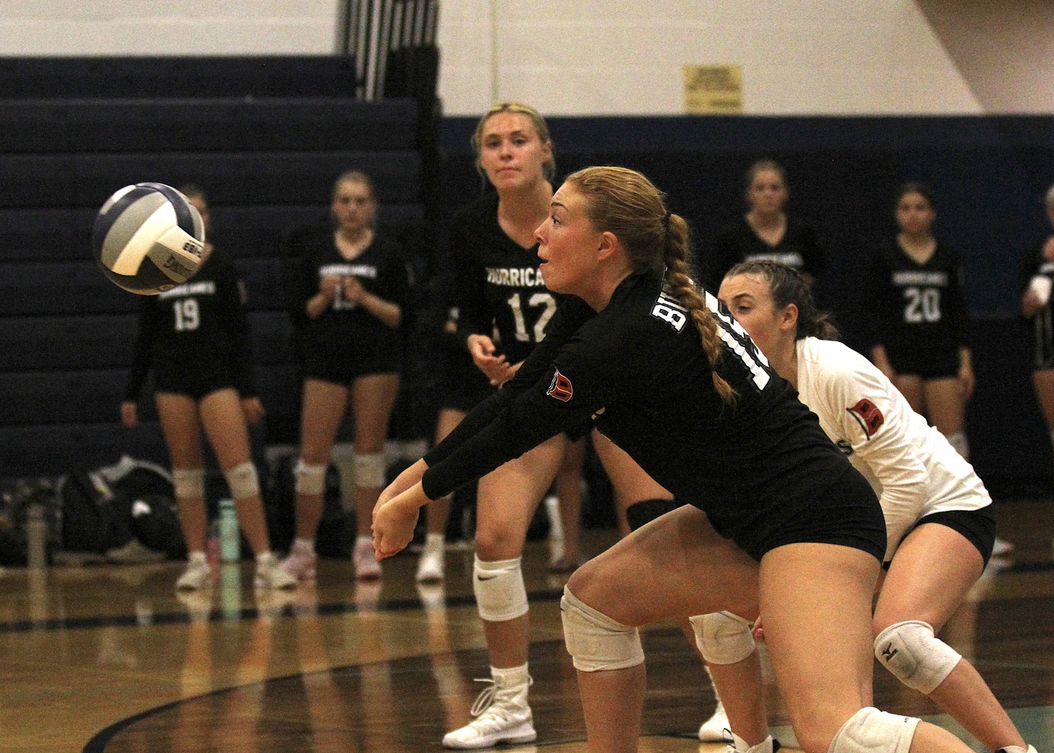 Senior outside hitter Katie Burke grabs the ball. DESIRÉE KEEGAN