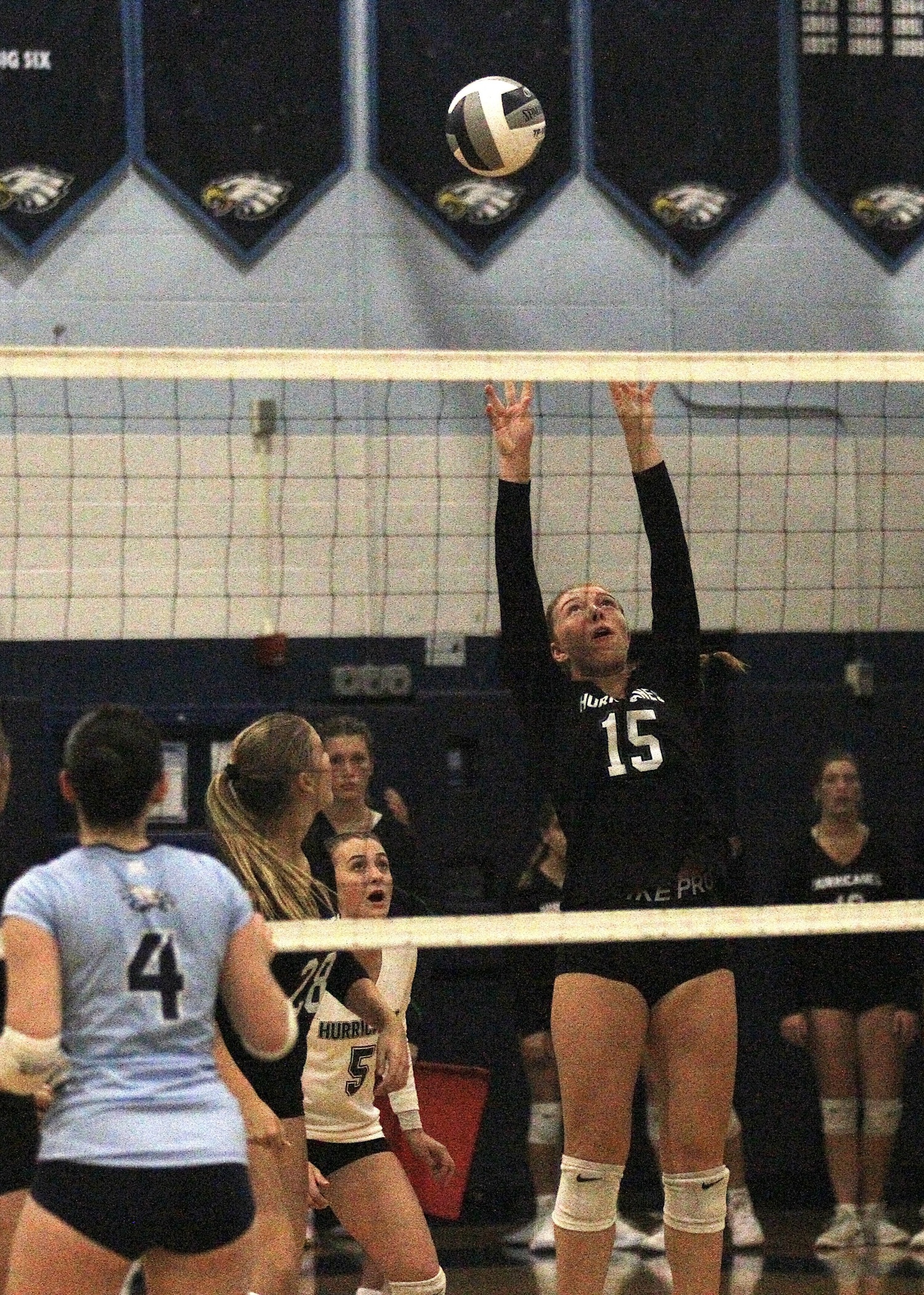 Senior outside hitter Katie Burke sends the ball over the net. DESIRÉE KEEGAN