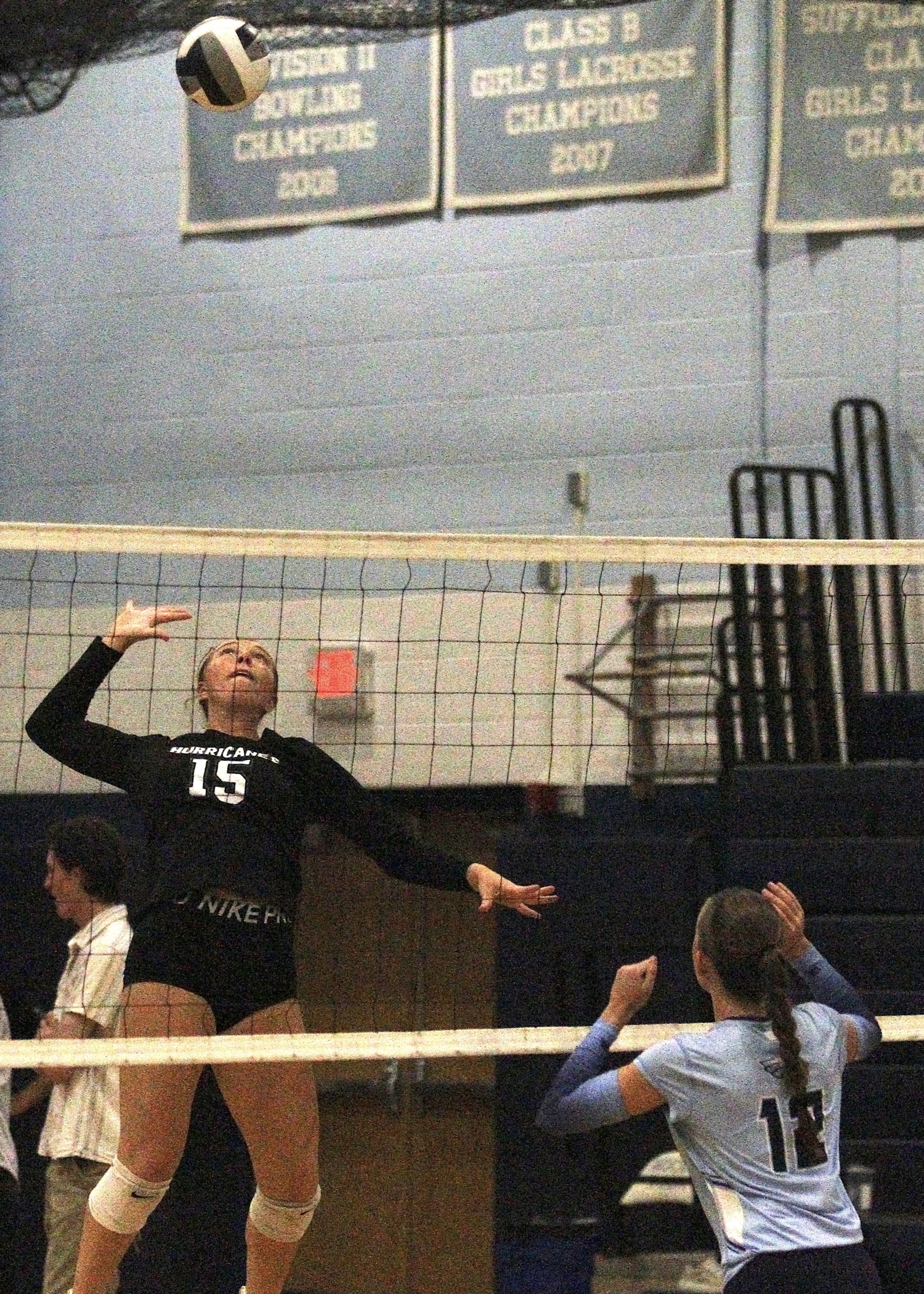 Senior outside hitter Katie Burke leaps up to spike the ball. DESIRÉE KEEGAN