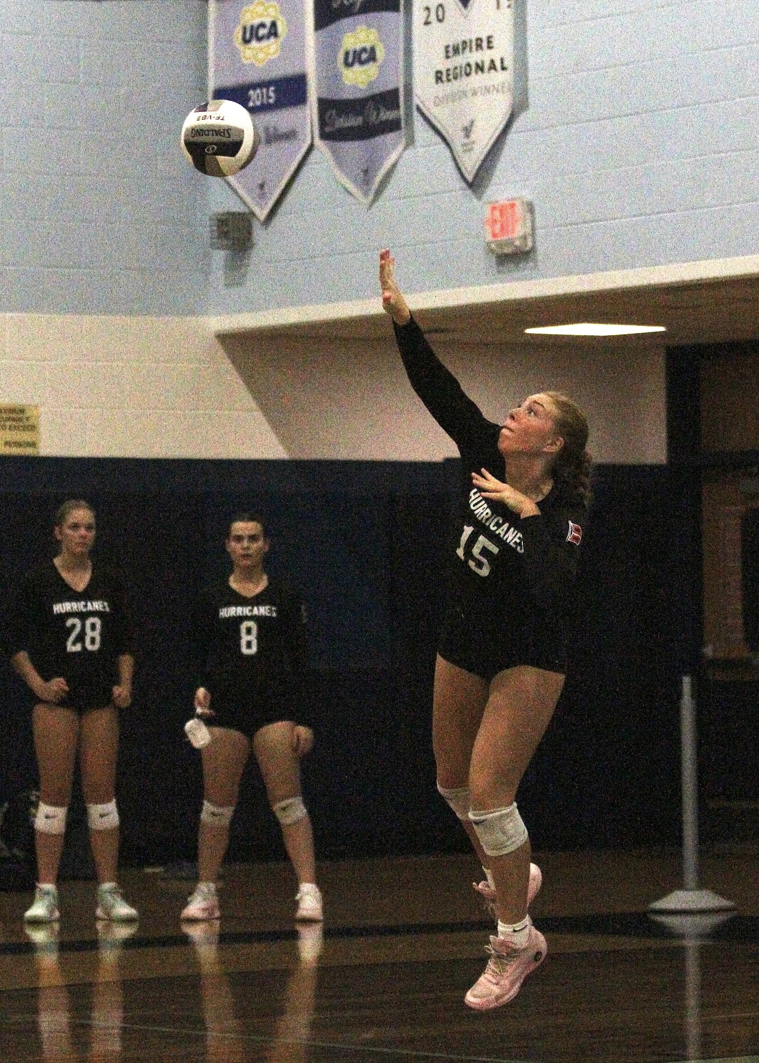 Senior outside hitter Katie Burke serves. DESIRÉE KEEGAN