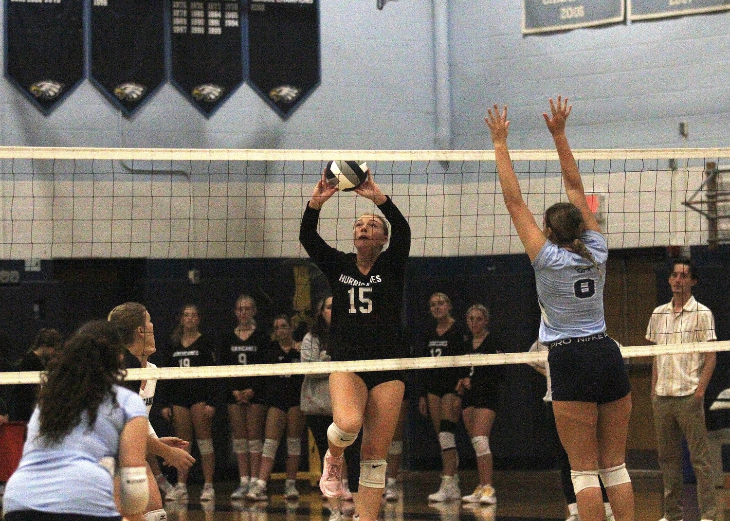 Senior outside hitter Katie Burke tips the ball. DESIRÉE KEEGAN