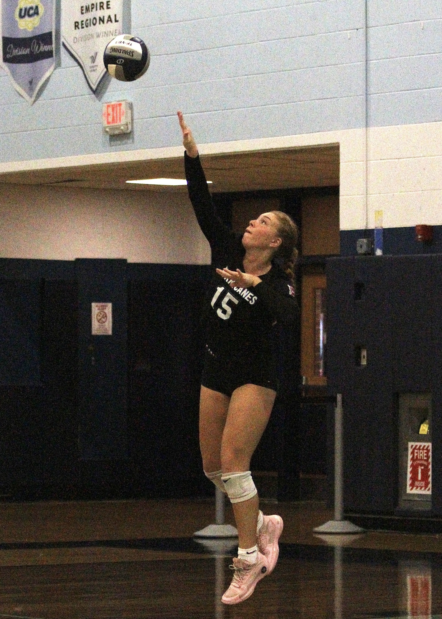 Senior outside hitter Katie Burke serves. DESIRÉE KEEGAN