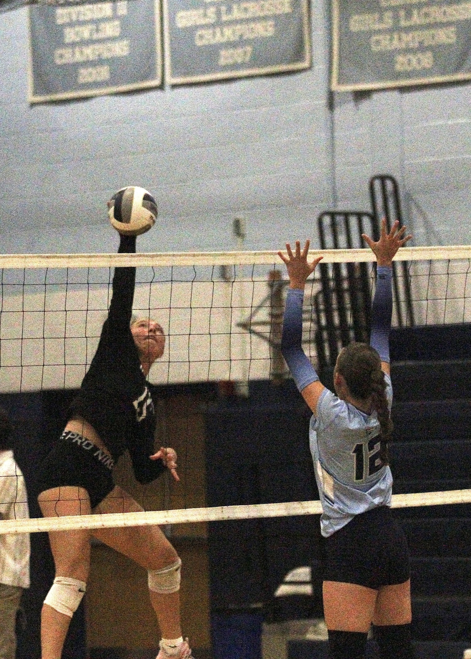 Senior outside hitter Katie Burke sends over one of her team-high  10 kills. DESIRÉE KEEGAN