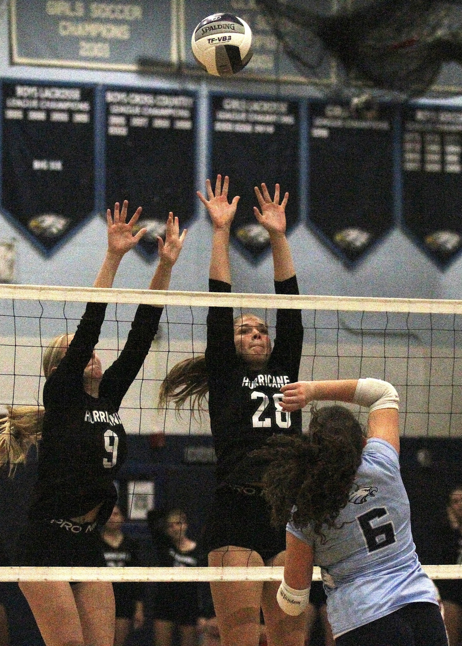Senior opposite hitter Lauren Glynn and sophomore middle blocker Reilly Maloney reach for the ball. DESIRÉE KEEGAN