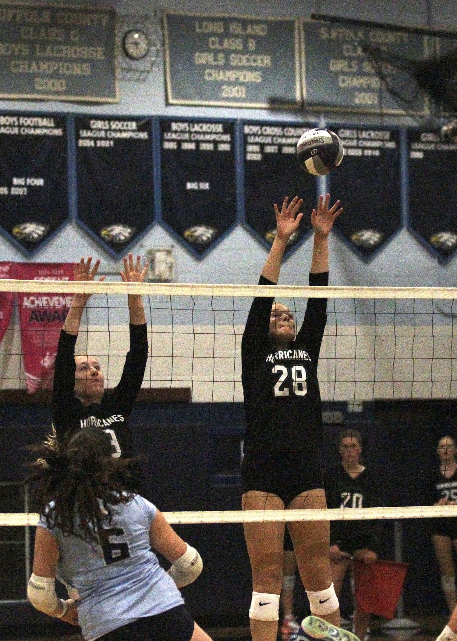 Sophomore middle blocker Reilly Maloney reaches for the ball. DESIRÉE KEEGAN