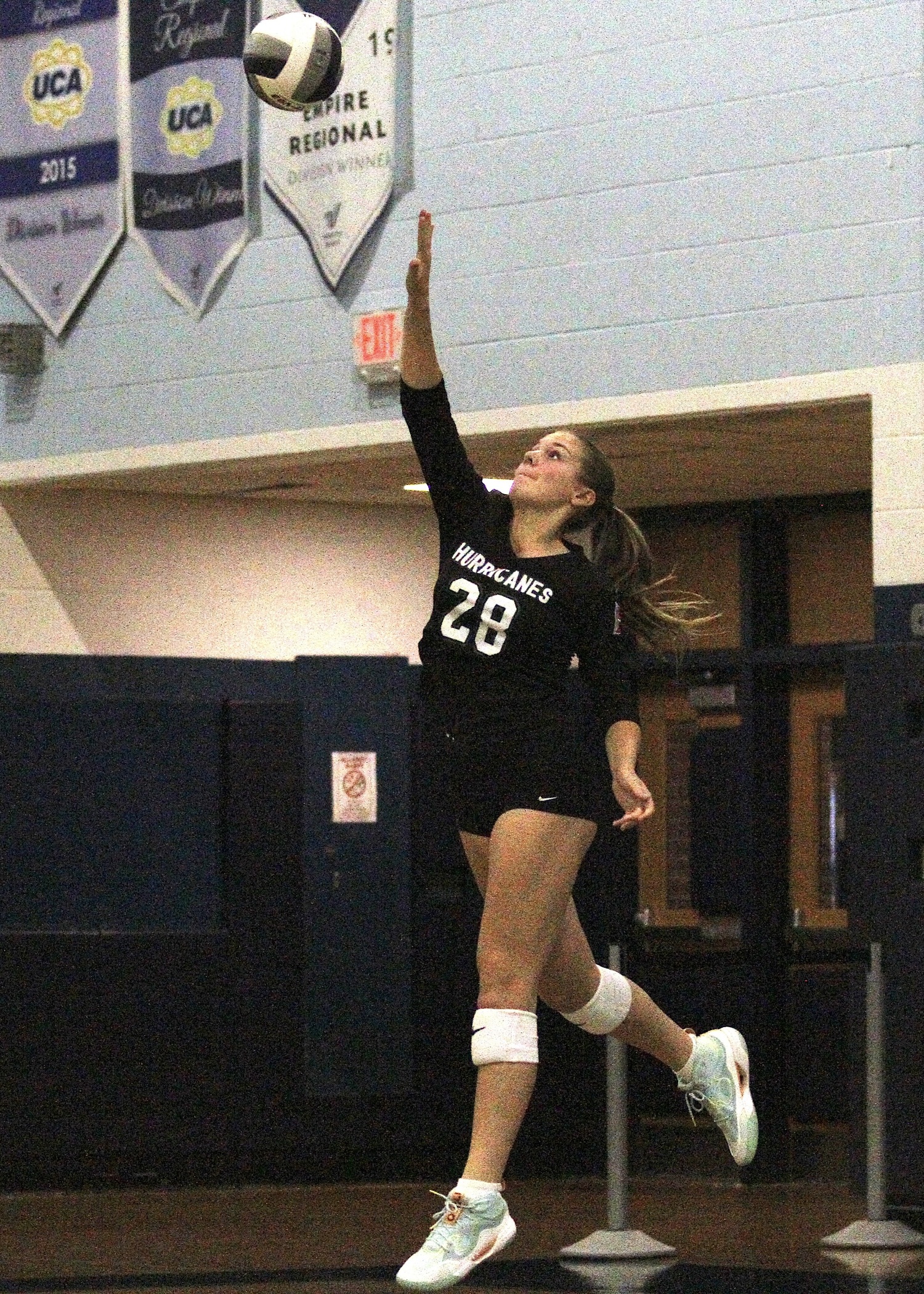 Sophomore middle blocker Reilly Maloney serves up an ace. DESIRÉE KEEGAN