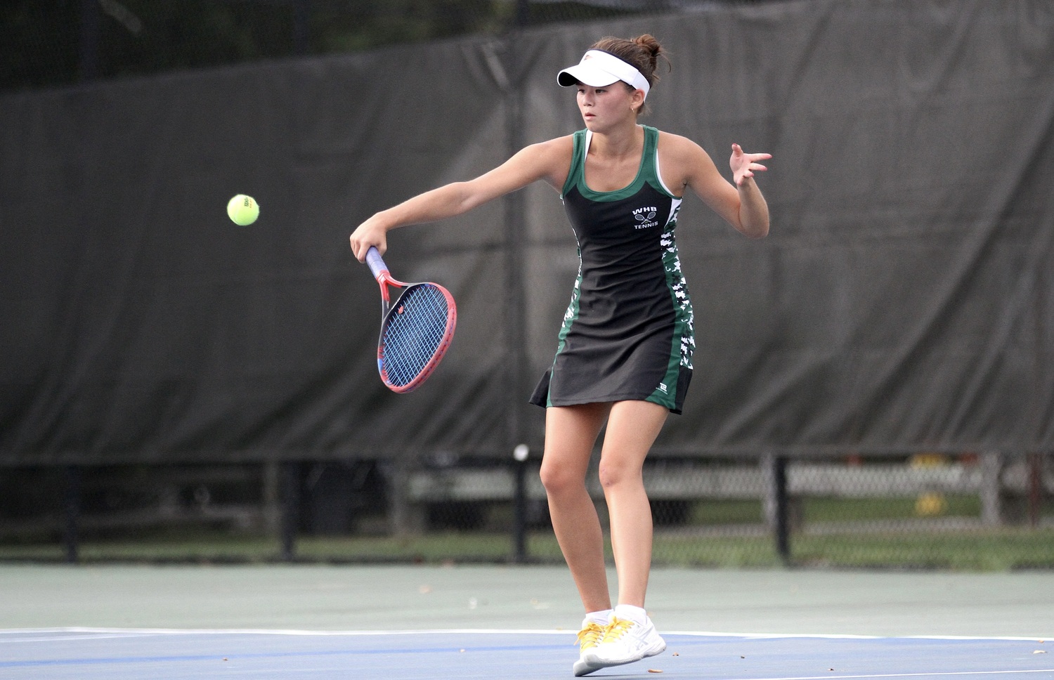 Senior Diana Elliott backhands the ball. DESIRÉE KEEGAN