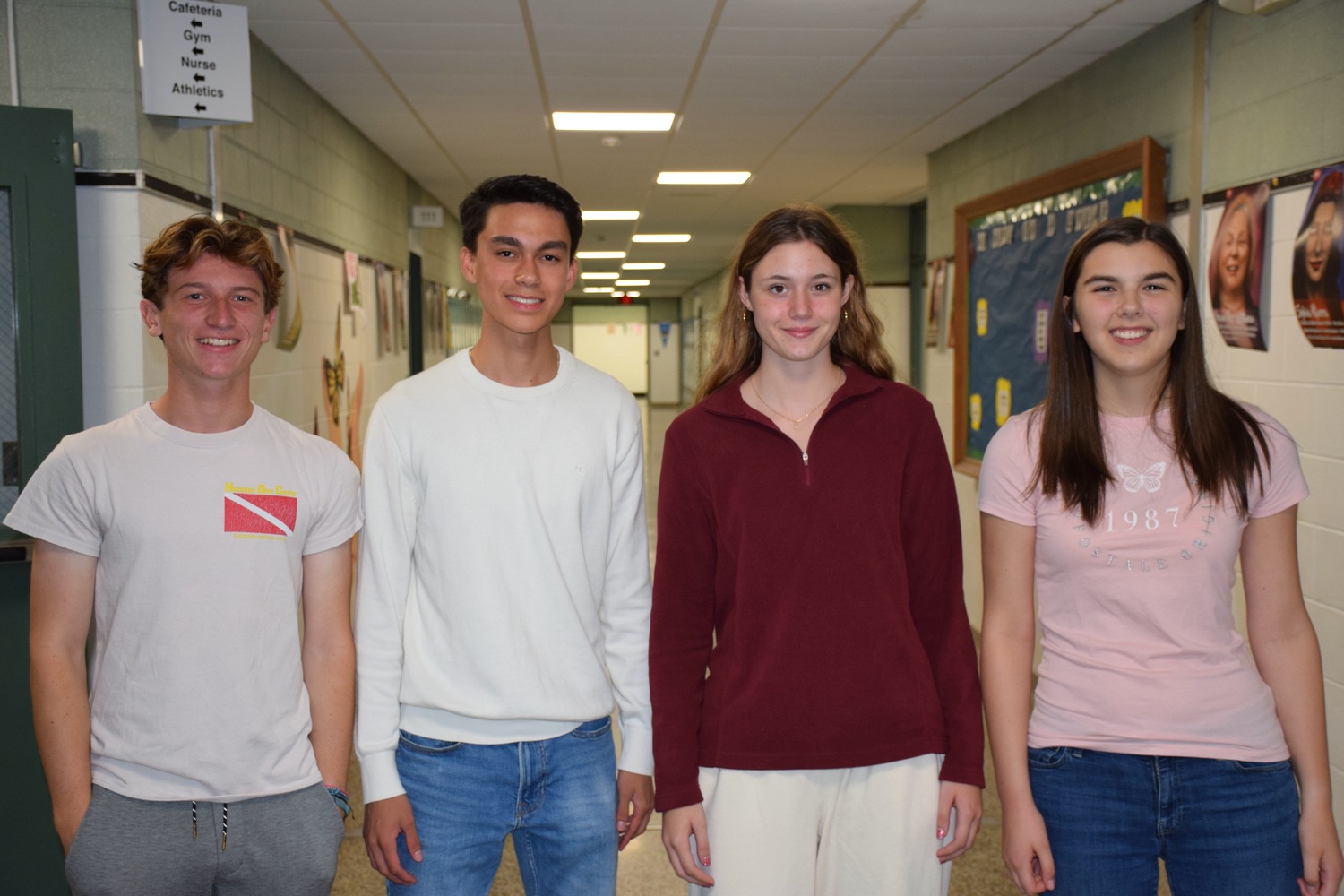 Westhampton Beach High School seniors, from left, Brady Schultz, Christopher Ramos, Lauren Kelly and Julia Sobhani were recognized as part of the National Merit Scholarship Program. COURTESY WESTHAMPTON BEACH SCHOOL DISTRICT