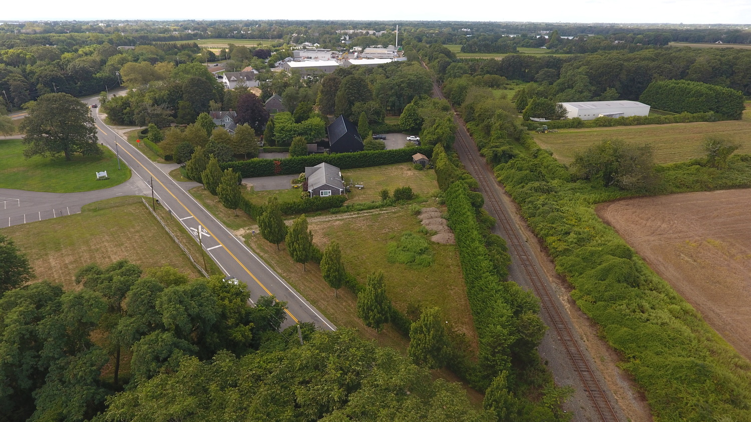 The owner of an East Hampton landscaping company plans to build two approximately 5,000 square foot office buildings, one for his company's offices and one for a school for kids with autism, on an acre of land off Scuttlehole Road in Water Mill. He has proposed putting in three affordable-priced apartments as well, to house some of his company's employees. MICHAEL WRIGHT