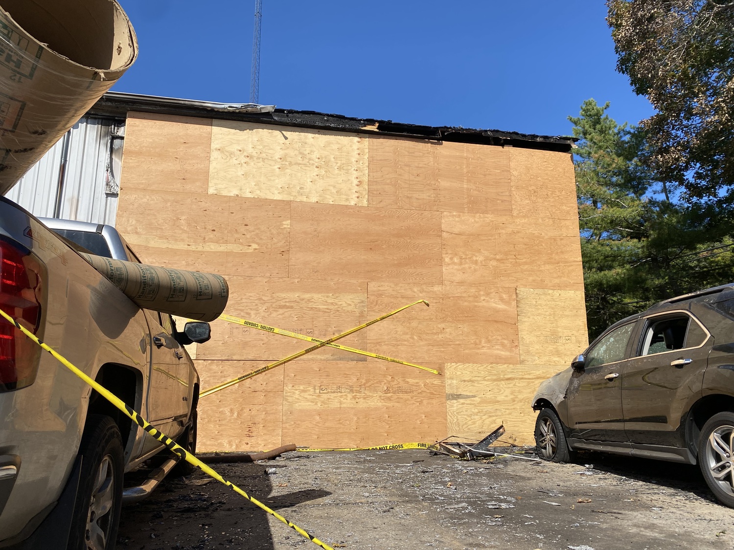 On Monday, the garage on Springs Fireplace Road was boarded up. Two damaged vehicles remained parked outside. Town Fire Marshal David Browne said the fire started while mechanics were doing hot work on a van. JACK MOTZ