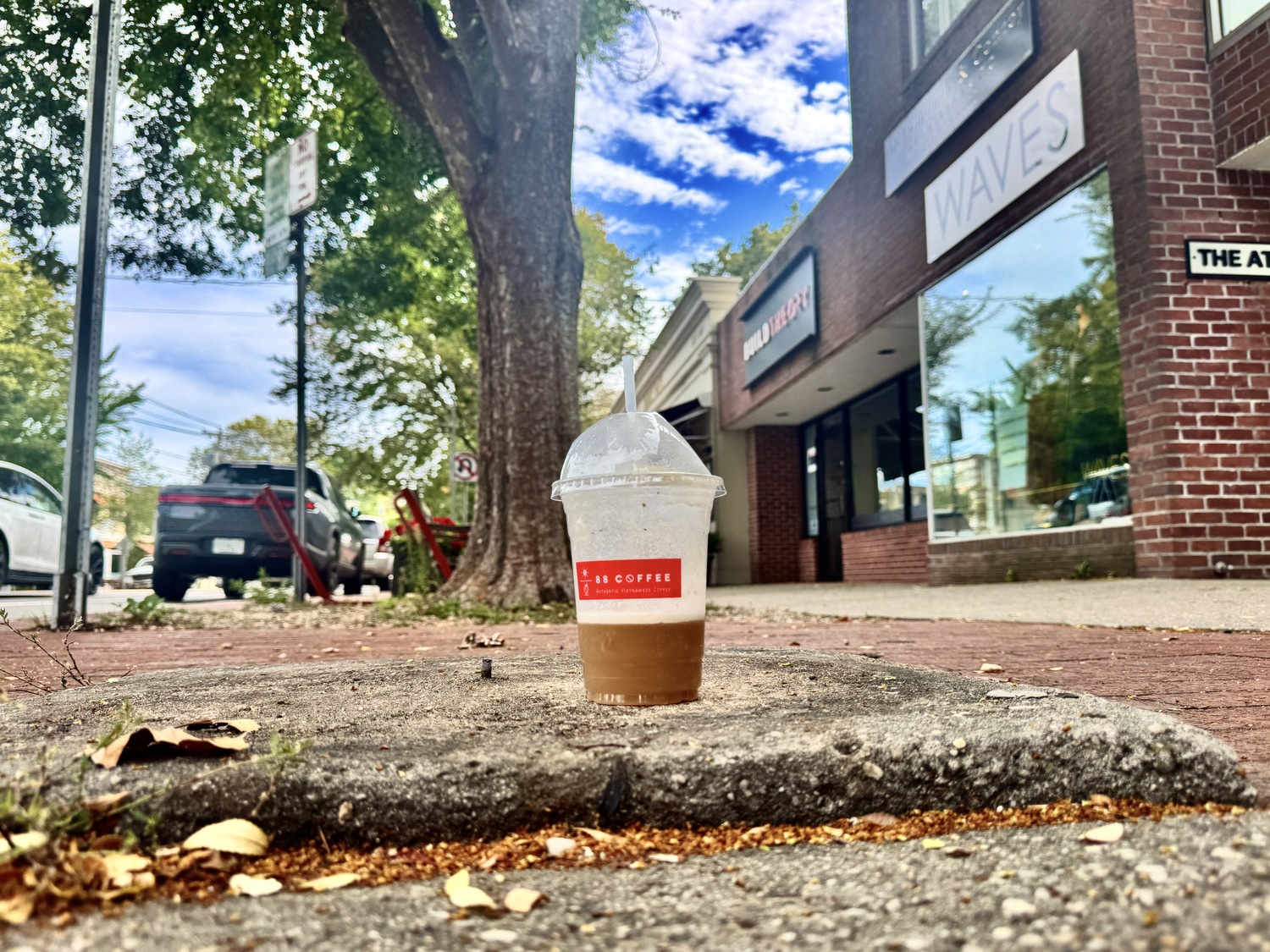 The concrete pads where garbage cans used to sit in downtown Hampton Bays and Bridgehampton are now vacant, but still seen as a good place to drop refuse by some. MICHAEL WRIGHT
