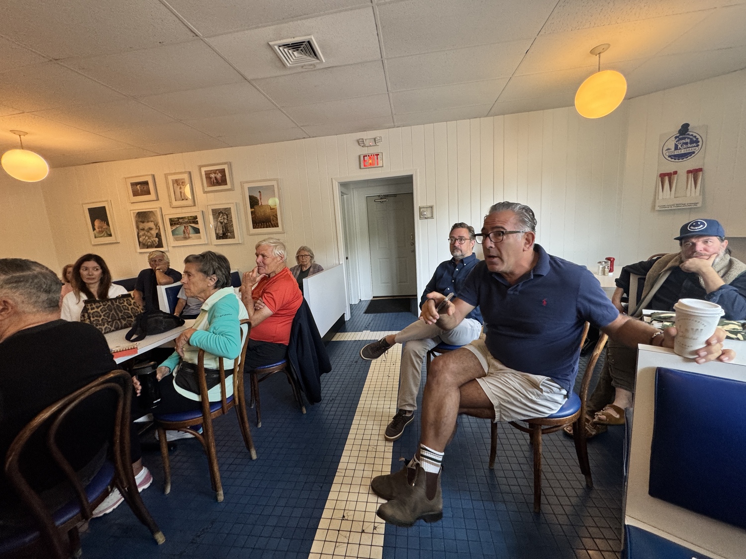 Bridgehampton business owners and residents gathered at the Candy Kitchen on Tuesday morning to discuss what can be done about the town having removed the trash cans from the hamlet's downtown. MICHAEL WRIGHT