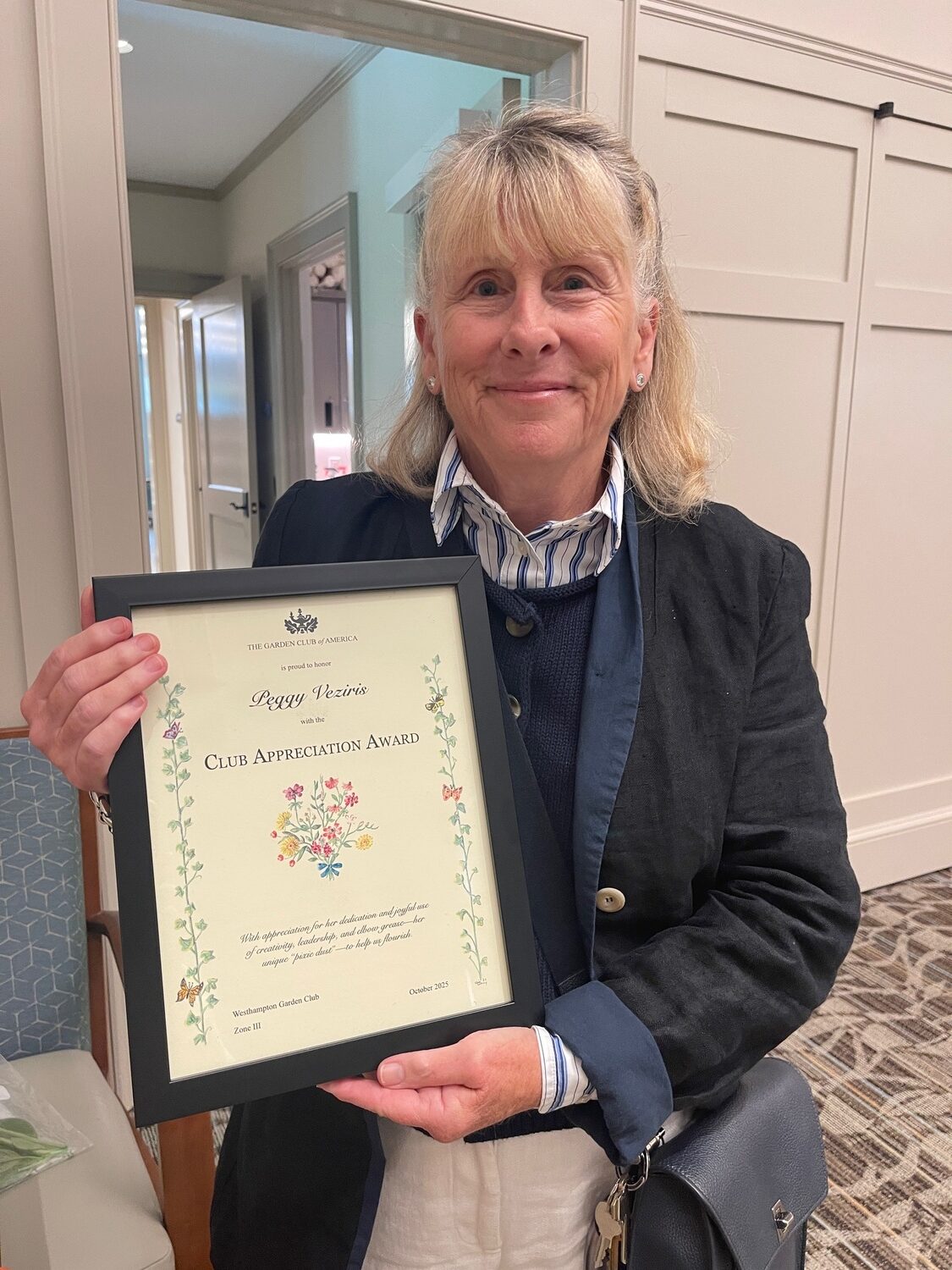 Westhampton Garden Club presented two  awards at its recent meeting.  First Vice-President and Gardens Chair Peggy Veziris received the Club Appreciation Award for her tireless support and mentoring of WGC members' conservation and preservation efforts, as well as overseeing the five public gardens that the club established and maintains in Westhampton and Quogue.  Hala Lawrence received the Years of Service Award for 25 years of dedication to ecological gardening and support of her colleagues. She also was elected an honorary member  of the club upon her  retirement. Peggy Veziris with Club Appreciation Award. COURTESY LYNDA CONFESSORE