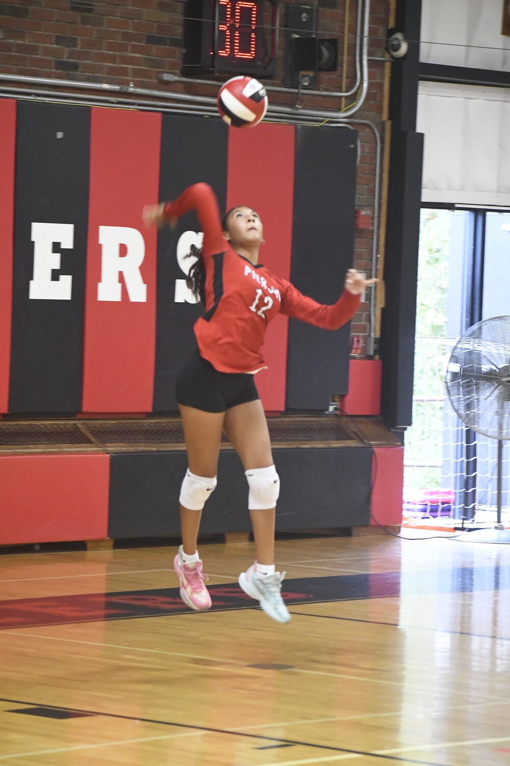 Sophomore Destiny Parker serves. DREW BUDD