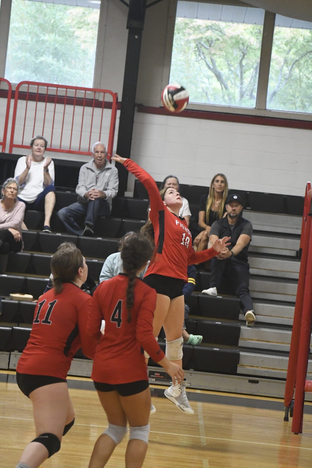 Senior Amy Fleming goes up to hit the ball. DREW BUDD