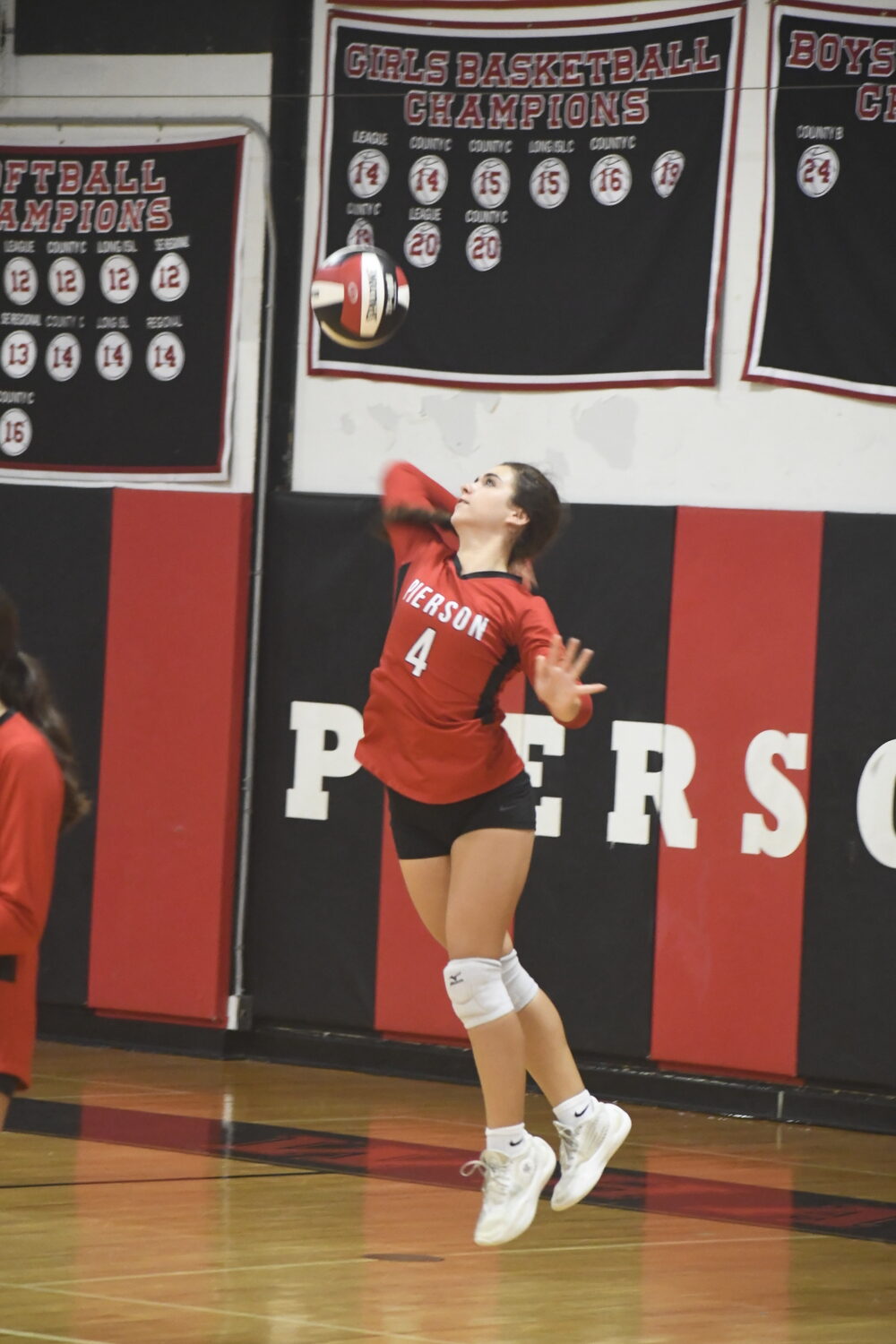 Sophomore Layla Garapie serves for the Whalers.  DREW BUDD