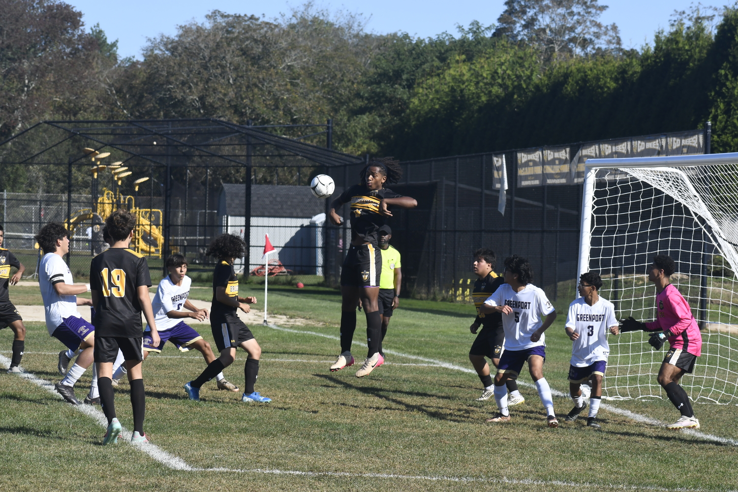 Bridgehampton junior Jordyn Turner tries to get his head on an incoming corner kick.  DREW BUDD