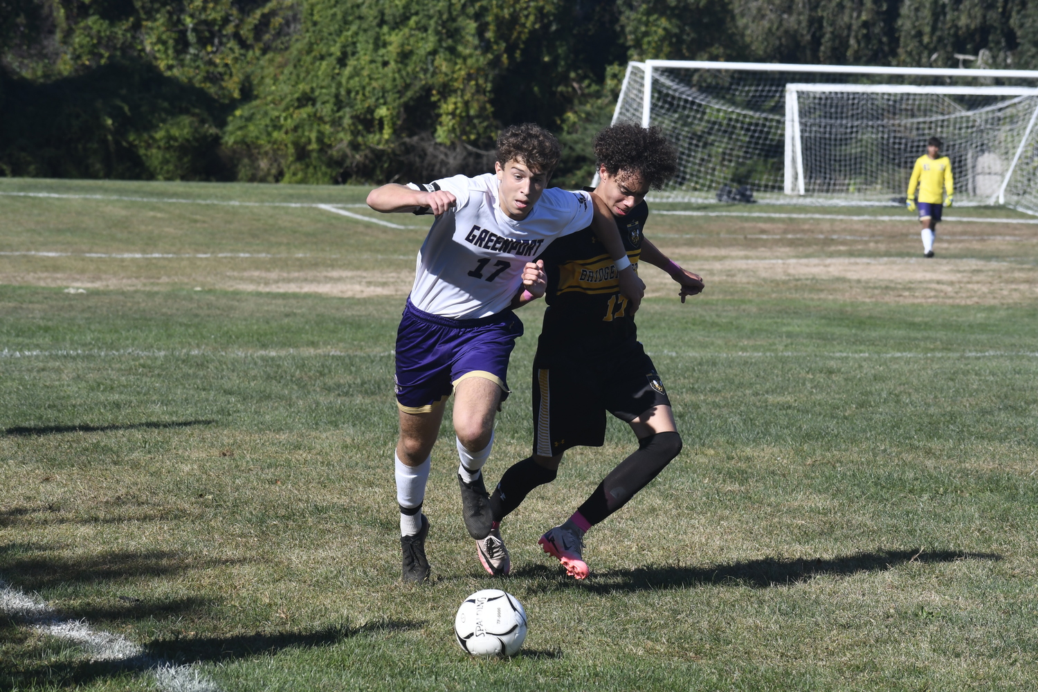 Bridgehampton junior Luka Hope and Greenport junior Matthew Malinowski go after the ball.  DREW BUDD