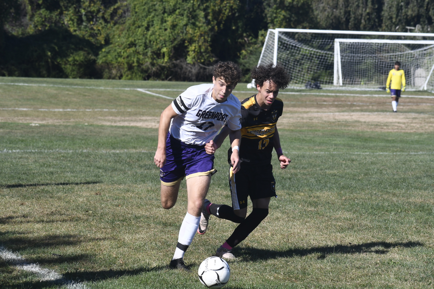 Bridgehampton junior Luka Hope and Greenport junior Matthew Malinowski go after the ball. DREW BUDD