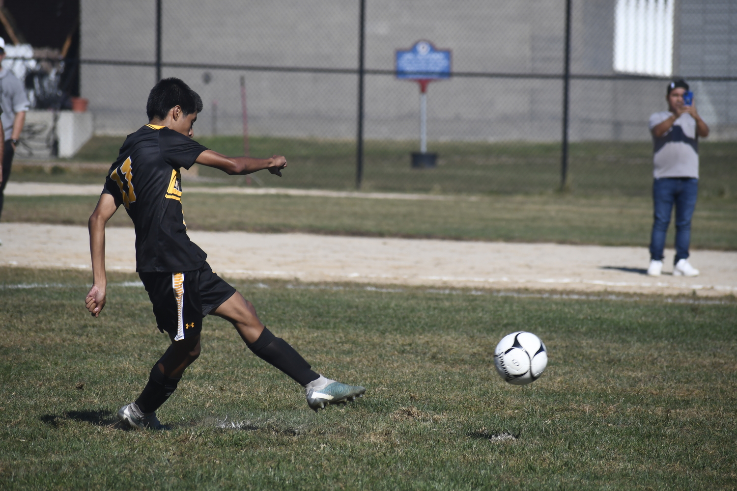 Bridgehampton sophomore Steven Lucero Morocho takes a successful penalty shot that put the Killer Bees on the board and on their way to eventually tying the game. DREW BUDD