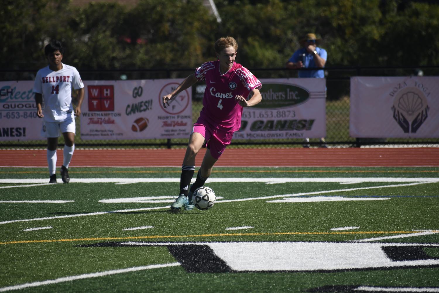 Westhampton Beach senior Anthony Atkinson works the ball at midfield.  DREW BUDD