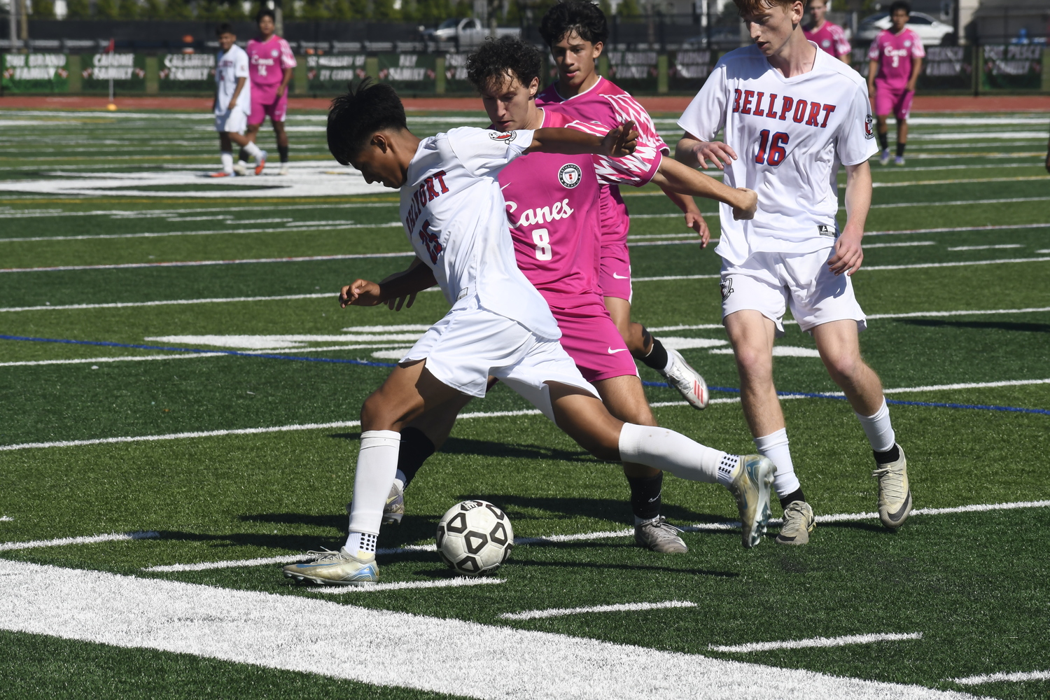 Westhampton Beach senior Markus Rahbari disrupts a Bellport player.  DREW BUDD