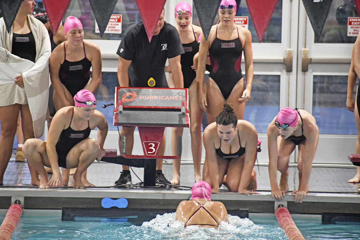 The Bonackers cheer on a teammate in a League II meet against Half Hollow Hills/Kings Park on October 8.  DREW BUDD