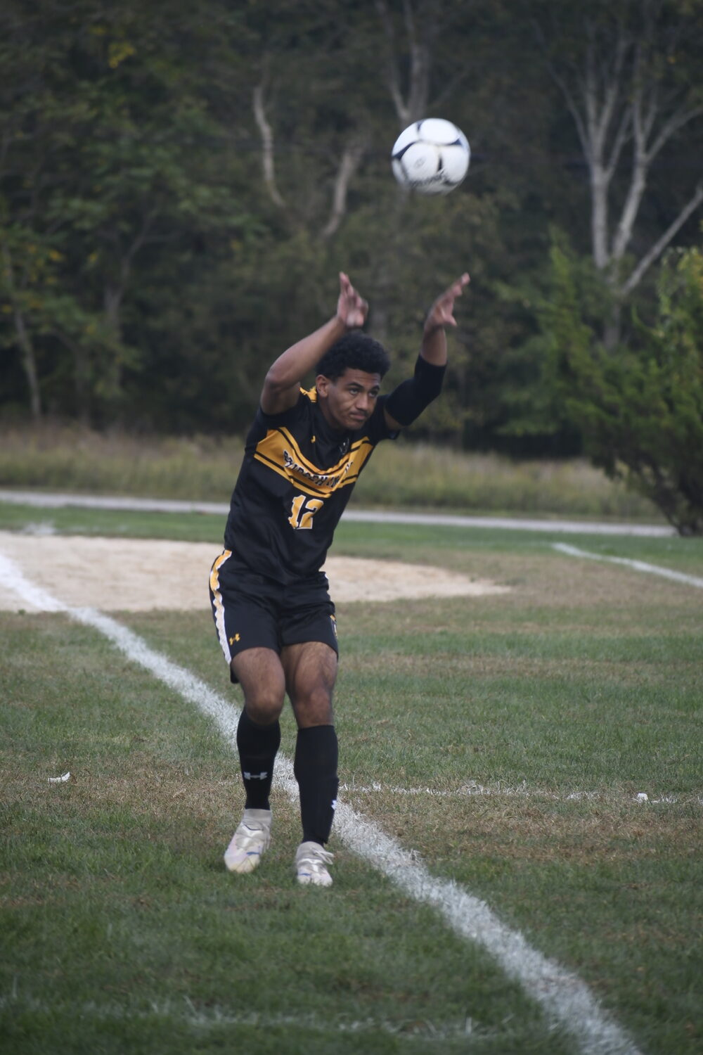 Bridgehampton junior Xavier Johnson throws the ball in.  DREW BUDD
