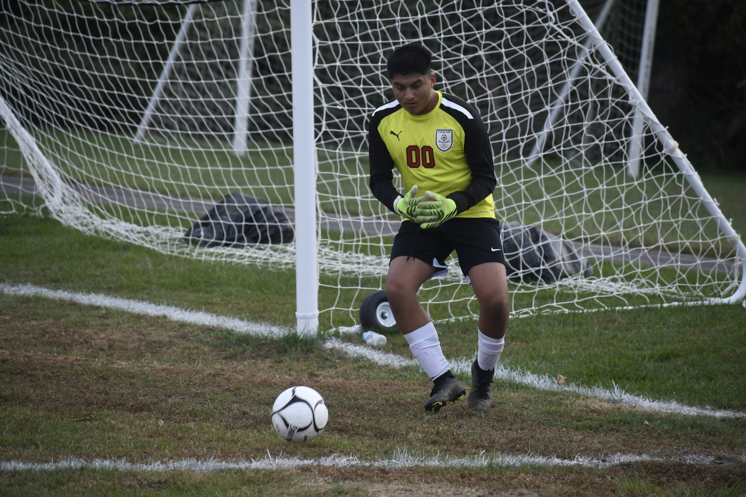 Pierson junior goalie Esteban Montanez plays an incoming ball in the box.  DREW BUDD