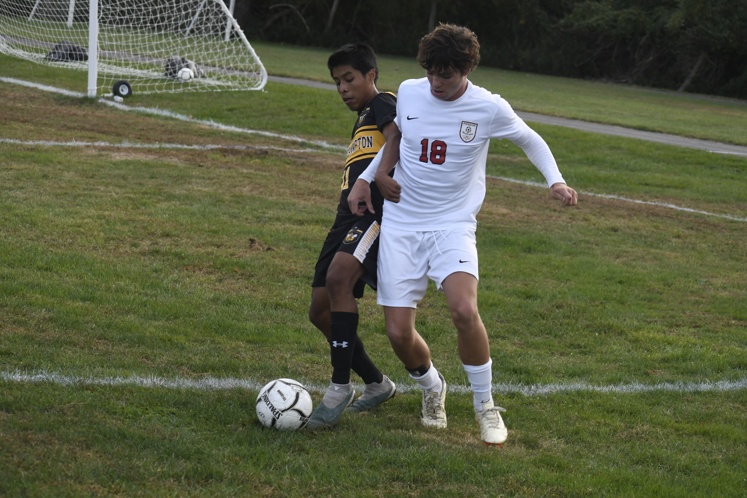 Bridgehampton sophomore Steven Lucero Morocho and Pierson senior Dylan Knapik battle for the ball. DREW BUDD