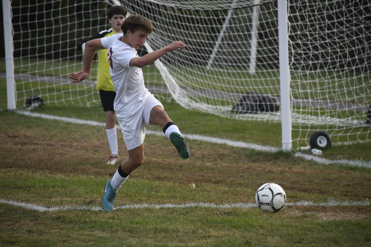 Pierson freshman Emmett Schumann clears the ball out of his team's defensive end. DREW BUDD