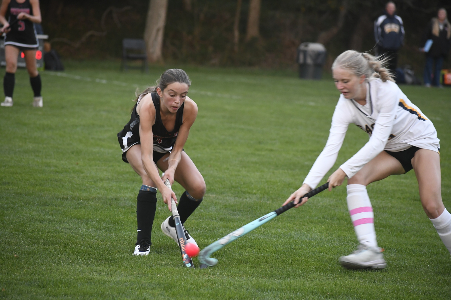 Pierson sophomore Zoe Esposito and West Babylon player go after the ball.  DREW BUDD