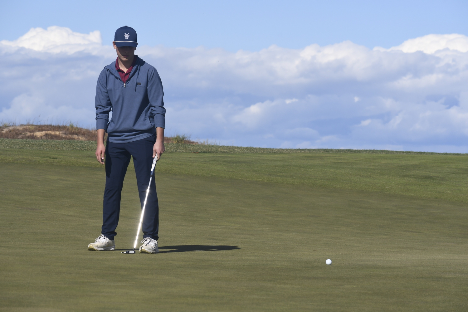 Southampton senior Colin DeLalio stands in disbelief after missing a putt on the 10th hole.  DREW BUDD