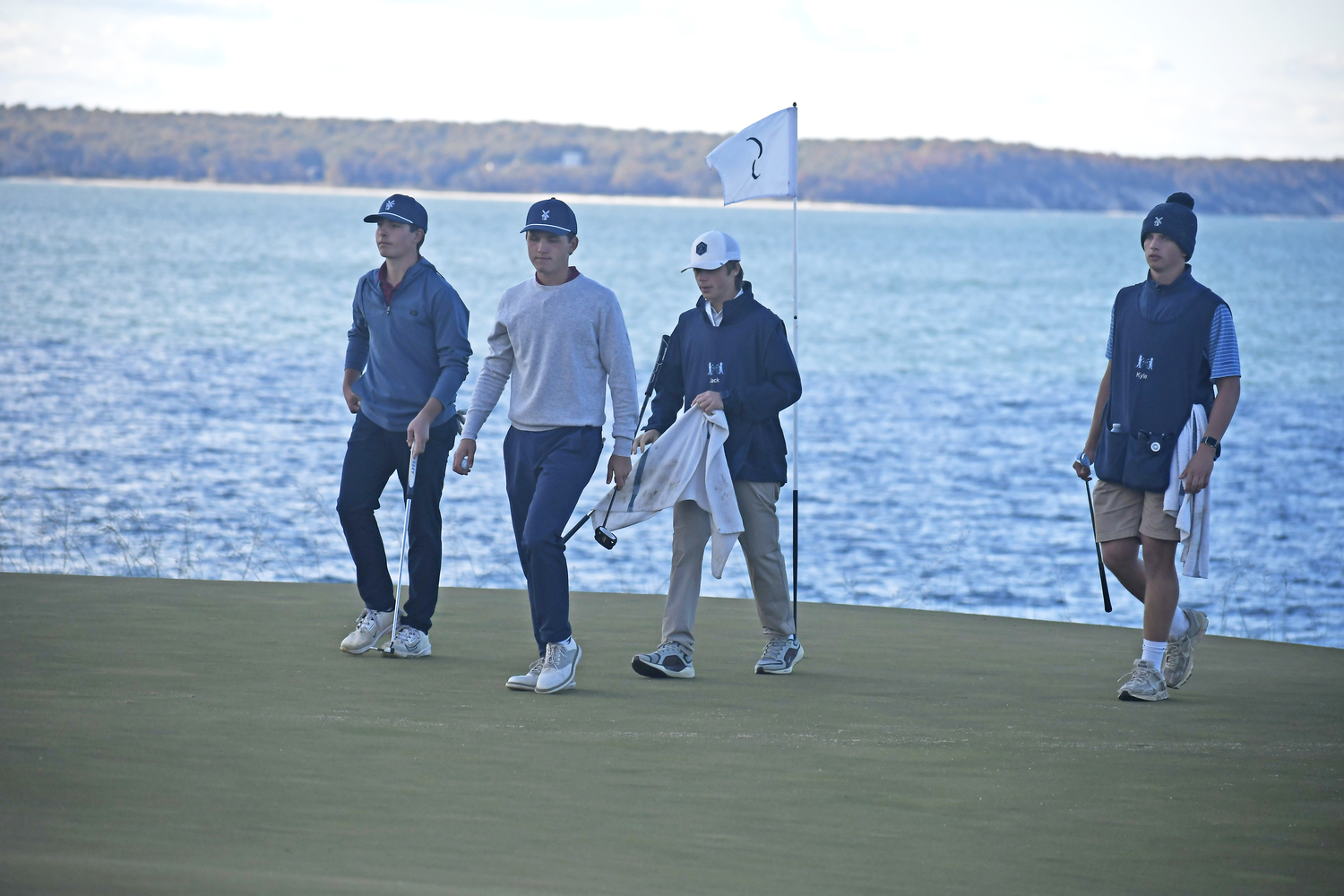 The Mariners walk off a hole together.  DREW BUDD