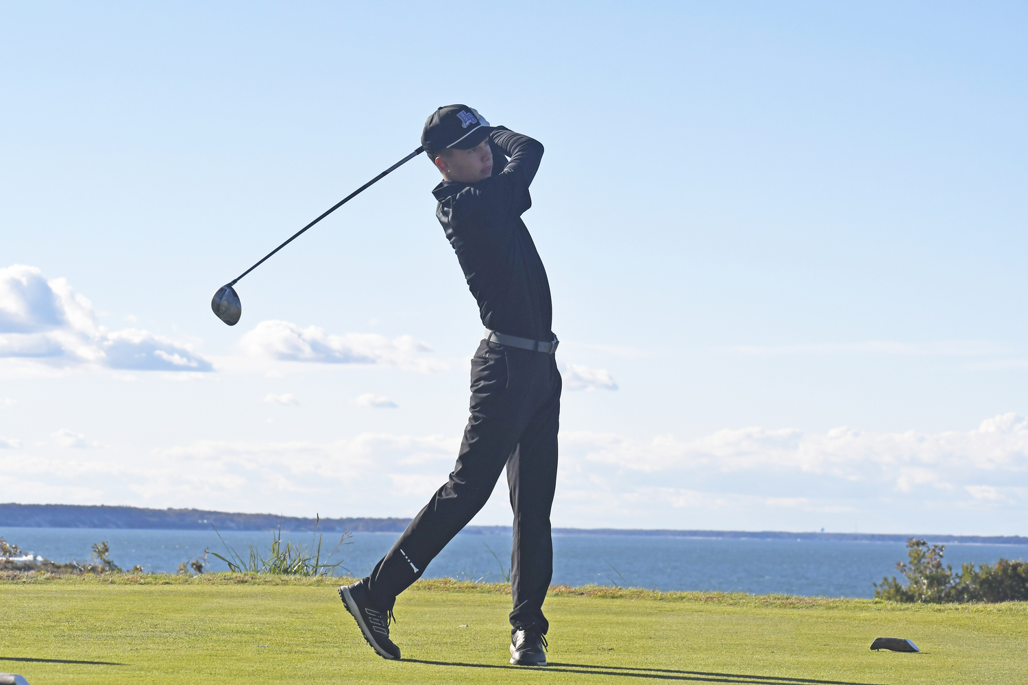 John Tedesco of Hampton Bays tees off on the final hole at Sebonack on Friday.  DREW BUDD