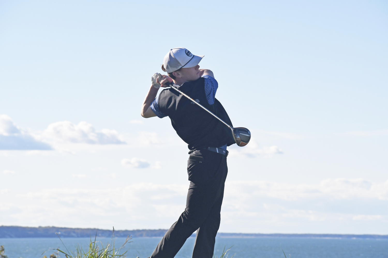 Pierson senior Spencer Cavaniola tees off on the final hole at Sebonack on Friday.  DREW BUDD