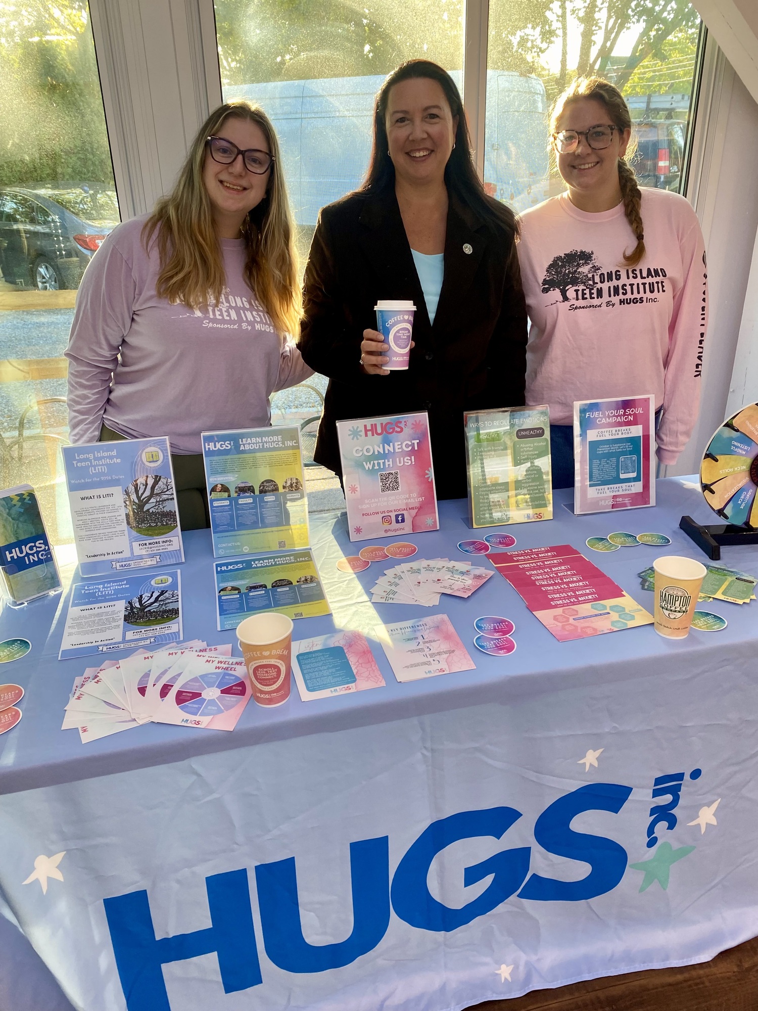 In recognition of National Substance Use Prevention Month, HUGS and SAFE in
Southampton teamed up with Hampton Coffee Company to launch the “Coffee Break Campaign” at Hampton Coffee Company in Hampton Bays and Westhampton Beach on October 1. Throughout the month
of October, medium-sized hot coffee drinks will be served in cups with positive and uplifting messages that can be shared on social media. Councilwoman Cyndi McNamara, liaison to SAFE in Southampton, attended the event and said, “This campaign is part of an ongoing commitment to building a healthier community. Through initiatives like this, we can promote mental wellness and support one another through positive messaging.” COURTESY OFFICE OF CYNDI MCNAMARA