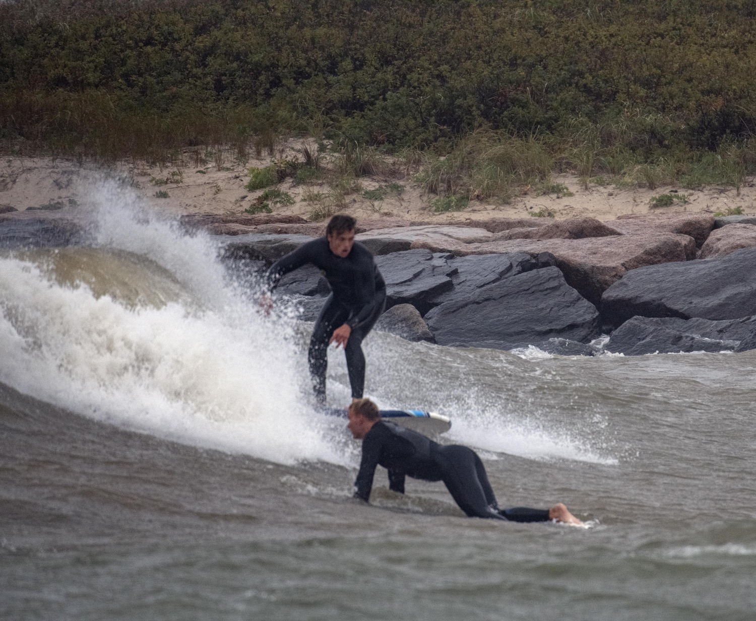 On Monday afternoon surfers catch a few waves inside the Montauk Breakwater that is the entry to Lake Montauk. Surfers rarely find this a place for good waves, but today was an exception. 
DOUG KUNTZ