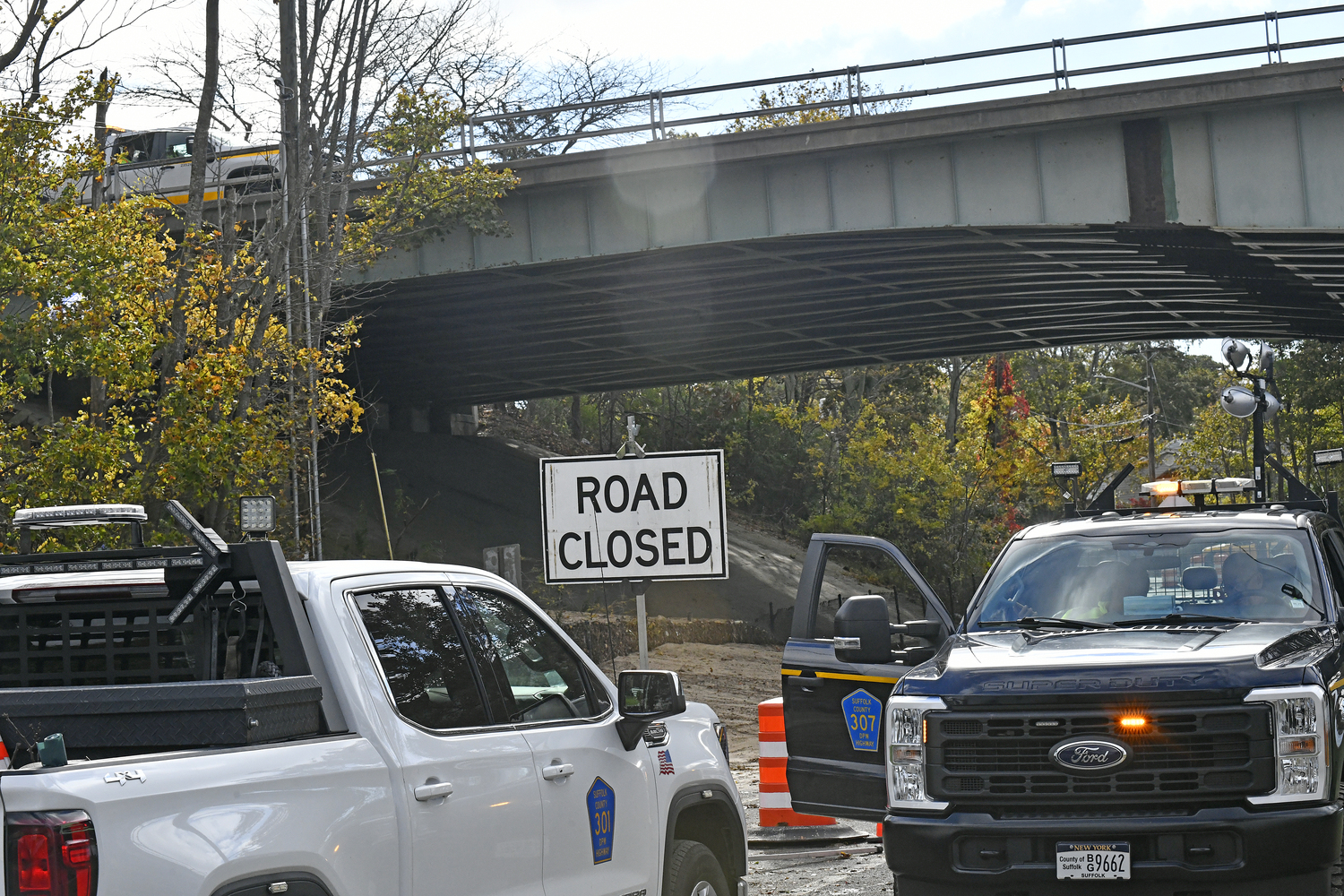 Heavy rainfall on Thursday night caused severe erosion beneath the westbound lanes of Sunrise Highway at the Shinnecock Canal, forcing the state Department of Transportation to close the roadway. Only very limited number of cars are being allowed to flow west on the highway using the road's shoulder.    DANA SHAW