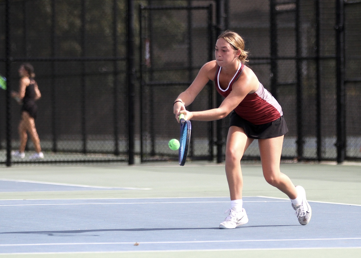 East Hampton senior Hailey Rigby comes in the return the ball. DESIRÉE KEEGAN